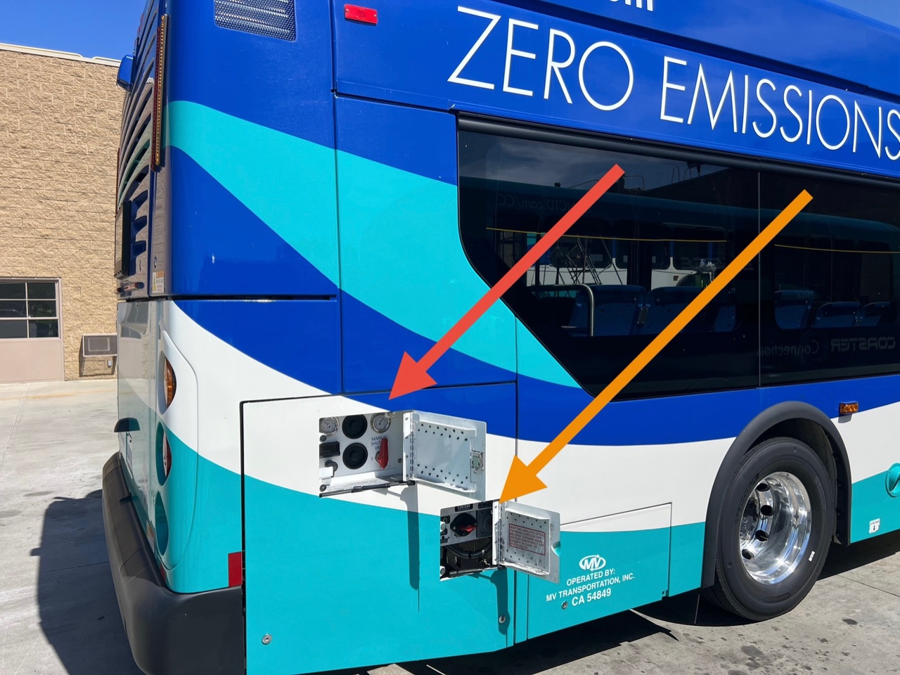 Annotated electric bus showing high-voltage component locations