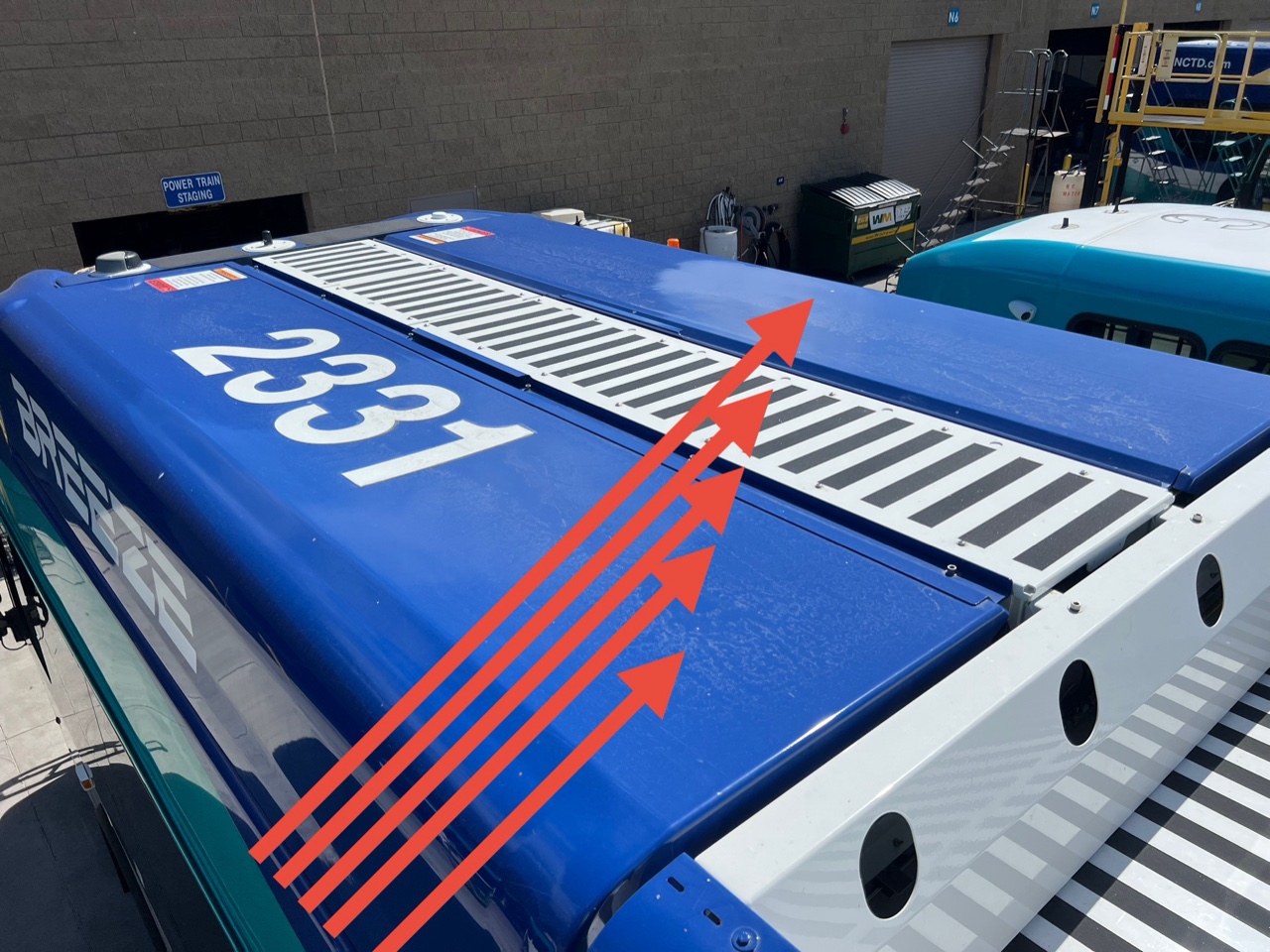 Annotated roof-mounted battery packs on an electric bus