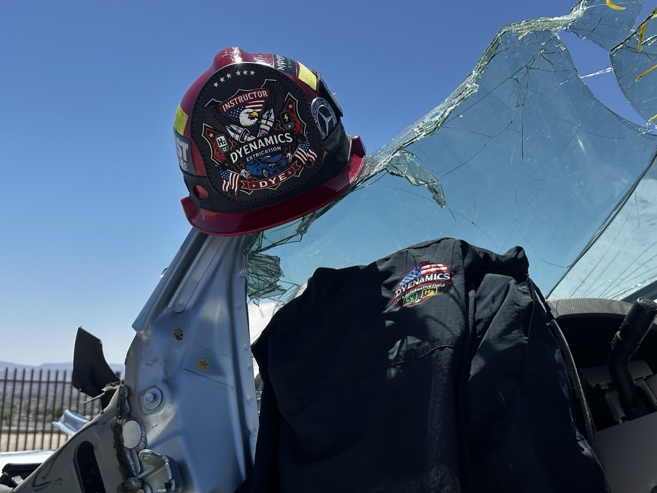 DyeNamics Extrication instructor helmet on a cut training vehicle
